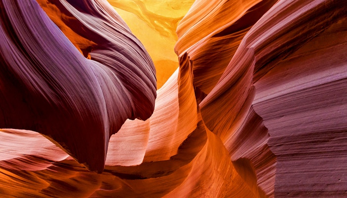 Aerial view of Antelope Canyon's swirling sandstone formations during a tour over Arizona.