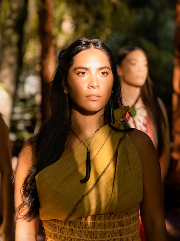 Traditional Māori attire worn by a woman at Te Pā Tū cultural experience.