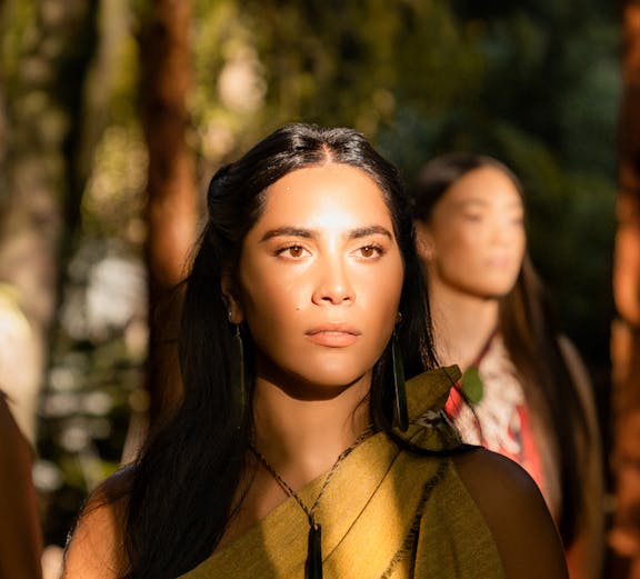 Traditional Māori attire worn by a woman at Te Pā Tū cultural experience.