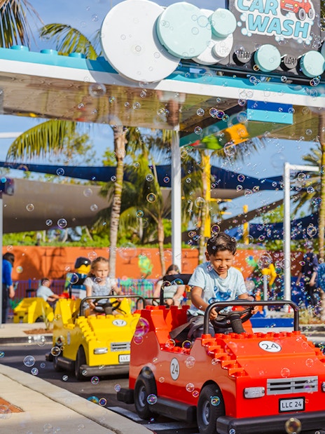 Children driving LEGO cars at Driving School, LEGOLAND® California.