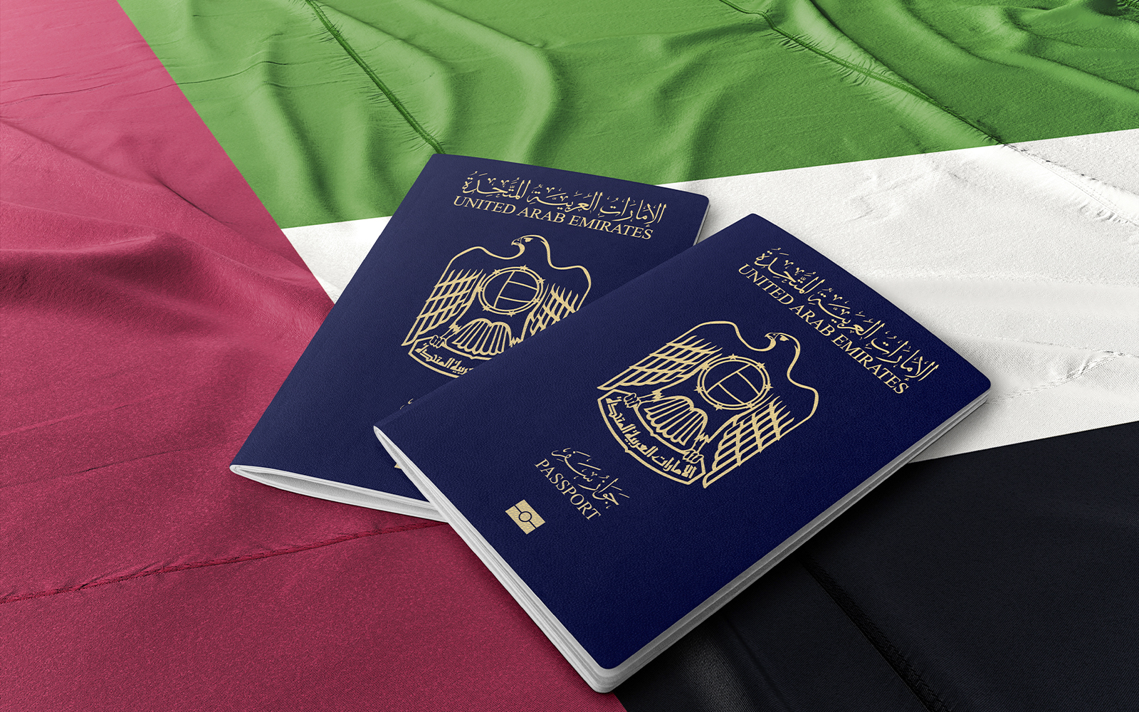 United Arab Emirates passports on UAE flag background.