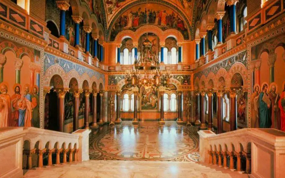 Throne room with ornate chandeliers and frescoes inside Neuschwanstein Castle, Germany.