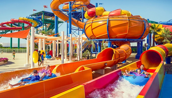 Children playing on water slides at LEGOLAND® Dubai Water Park, part of the Combo: LEGOLAND® Dubai + Dubai Safari Park tour.