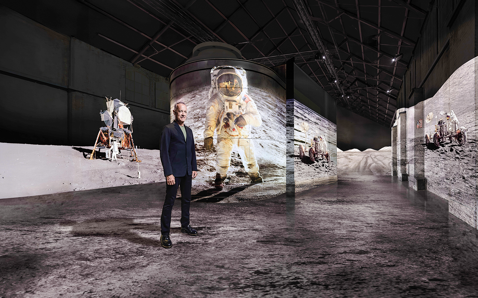 Visitor at Moonwalkers Exhibition, Fabrique des Lumières, Amsterdam, with lunar landing visuals.