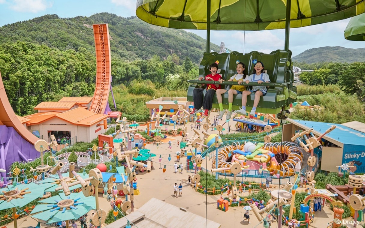 Children enjoying Toy Soldier Parachute Drop ride at Toy Story Land, Disneyland Hong Kong.