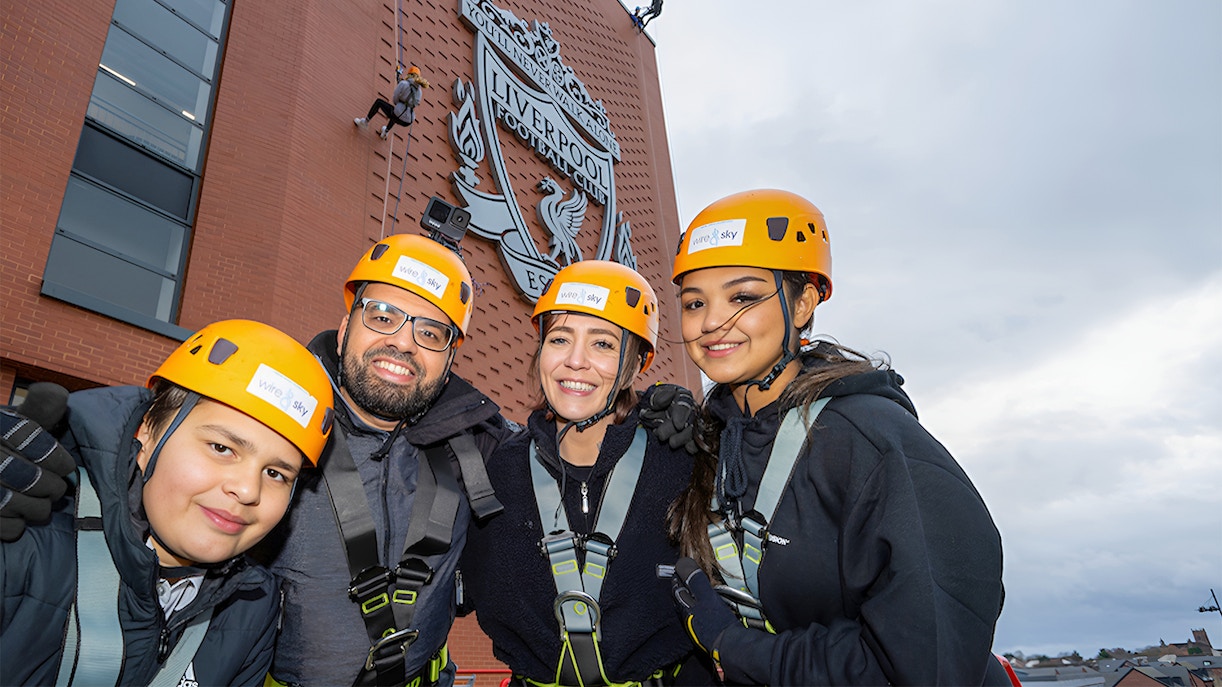 Tourists preparing for Anfield Abseil at Liverpool FC Stadium, a unique experience included with Museum Entrance Tickets