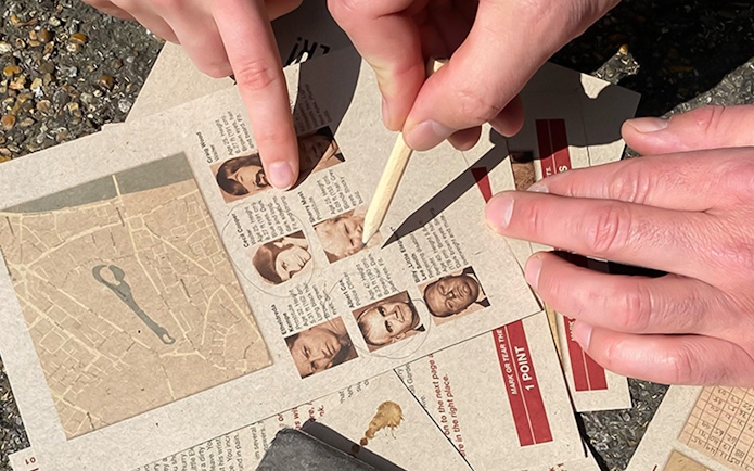 Participants solving clues during Nyhavn Mystery Adventure in Copenhagen.
