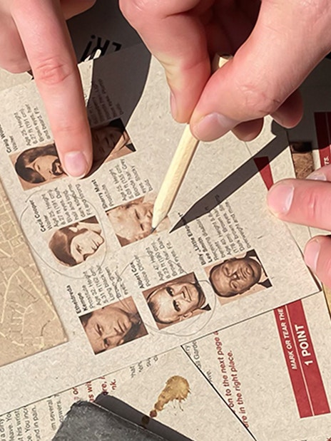 Participants solving clues during Nyhavn Mystery Adventure in Copenhagen.