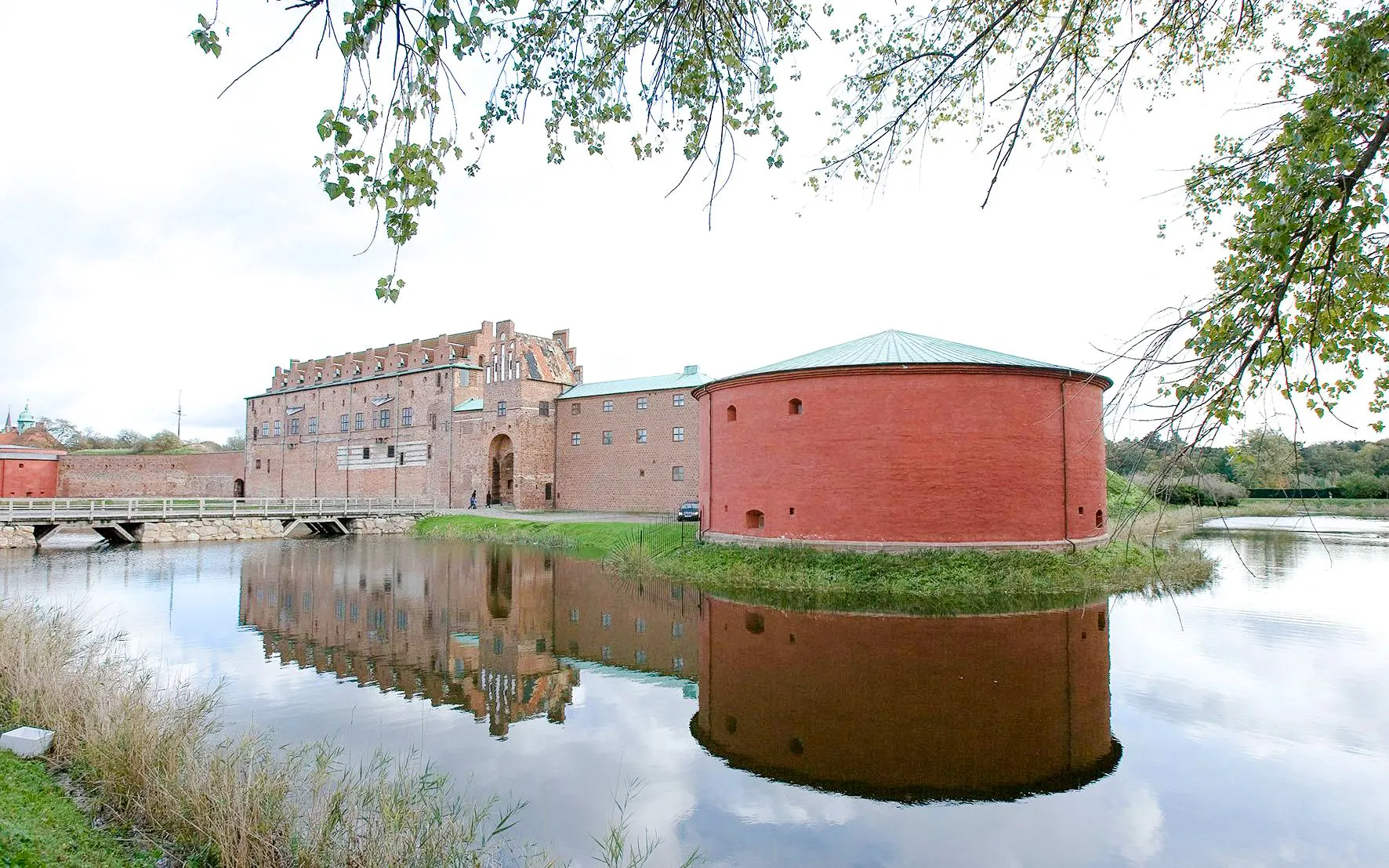 Malmö Castle with moat and reflection in Sweden.