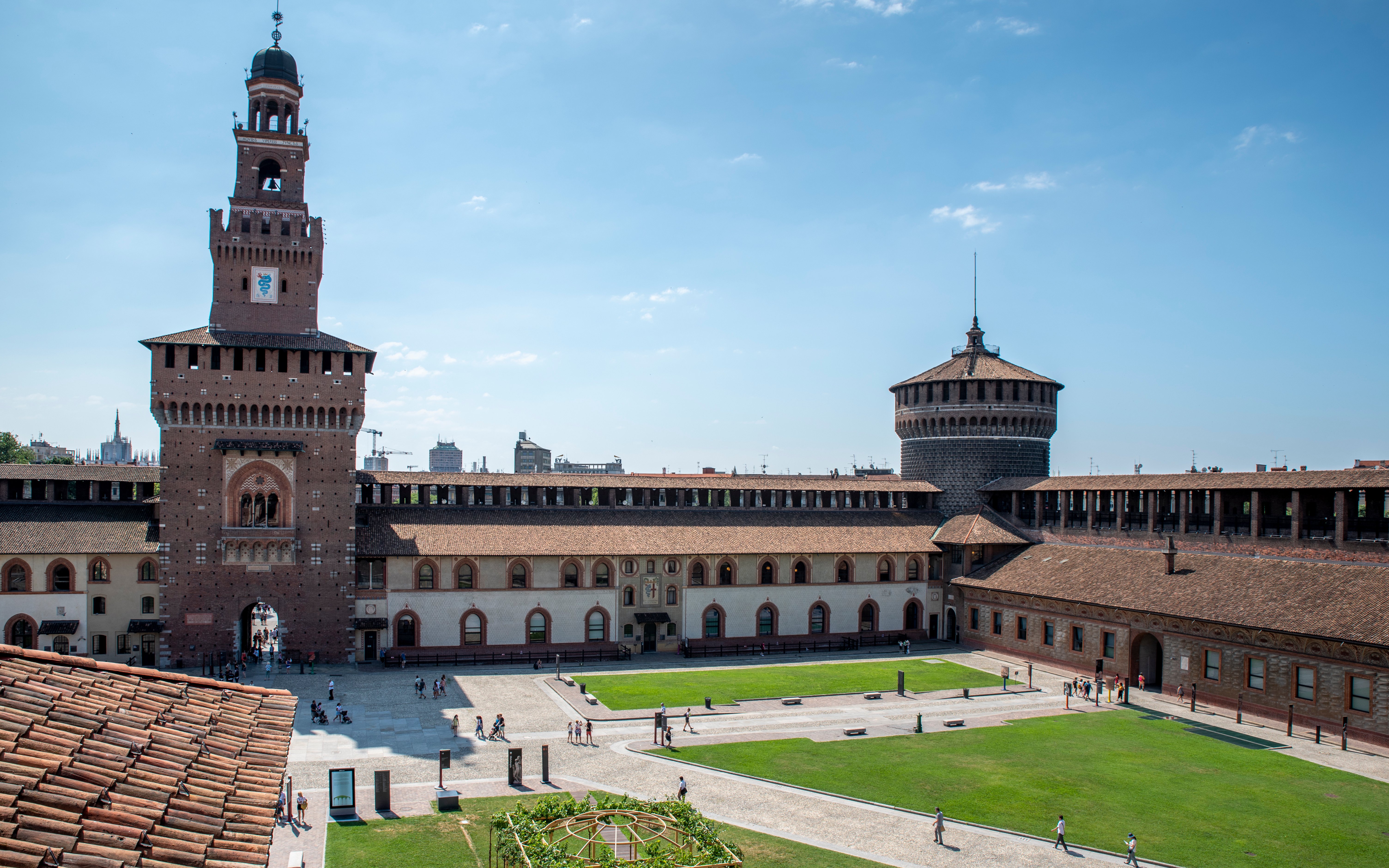 Sforza Castle courtyard with historic towers in Milan, Italy.