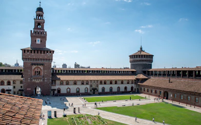 Sforza Castle courtyard with historic towers in Milan, Italy.