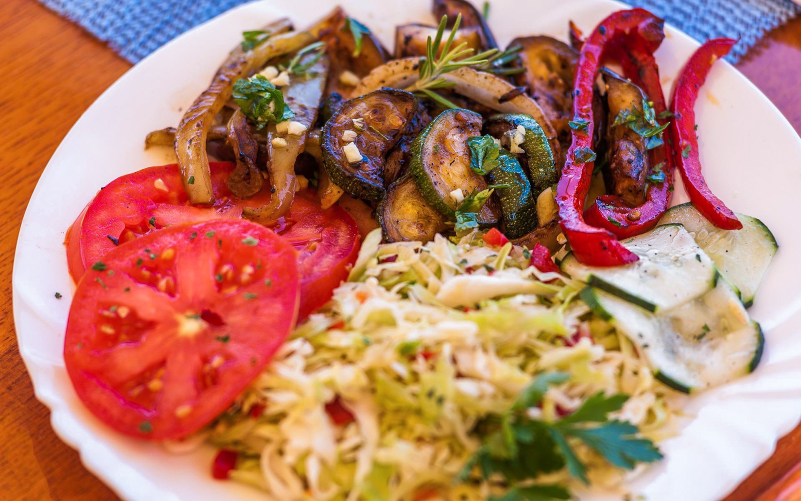Grilled vegetables and fresh salad served on a Dubrovnik boat tour lunch.