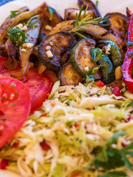 Grilled vegetables and fresh salad served on a Dubrovnik boat tour lunch.
