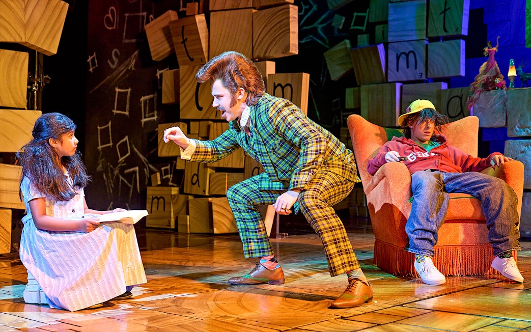 Matilda The Musical scene with characters interacting on stage.