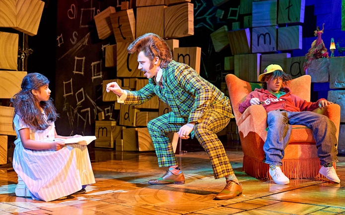 Matilda The Musical scene with characters interacting on stage.