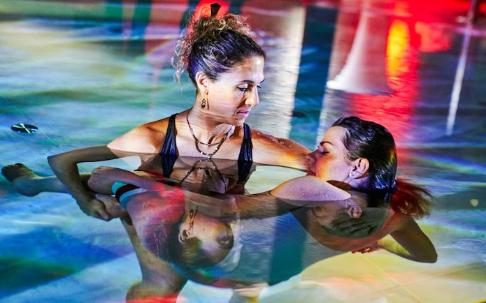 Two women practicing aquatic therapy at Mandala Day Spa.