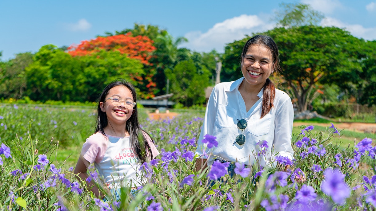 mother daughter having fun time in Buckingham Palace Garden