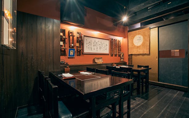 Dining area at Ginza Hanadaikon with traditional decor for 5/6-course meal experience.