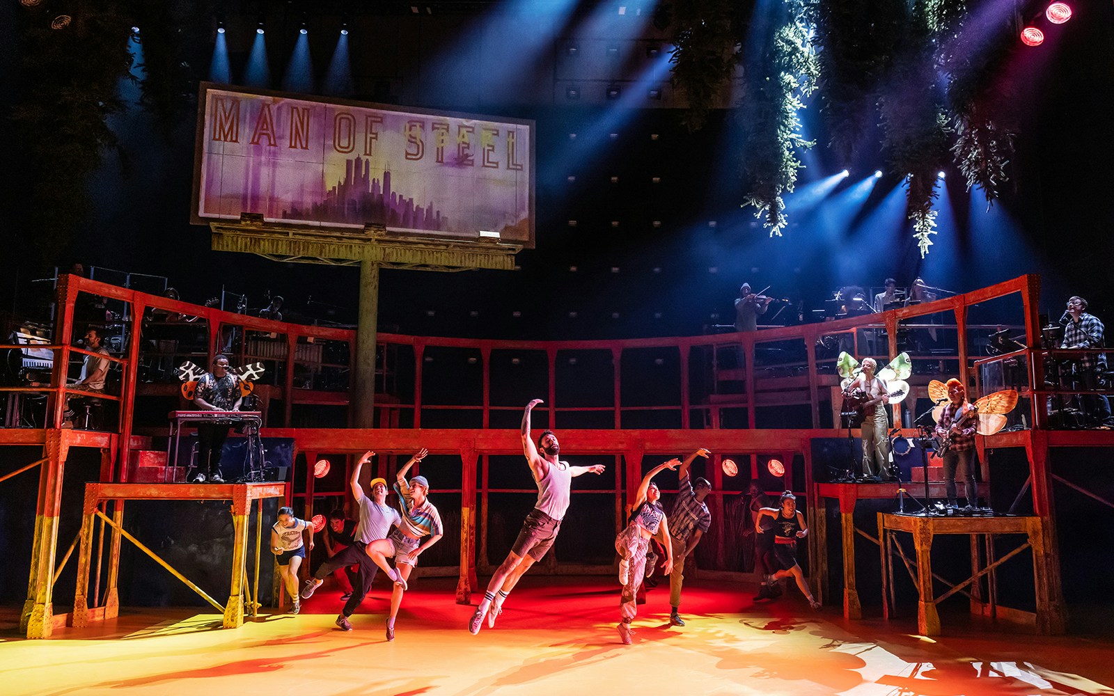 Dancers performing on stage with musicians in the background, Illinois.