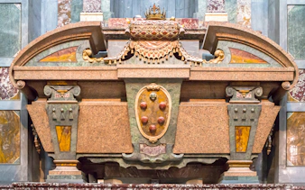 Sarcophagus of Cosimo II in Medici Chapel, Florence, detailed stone carvings.