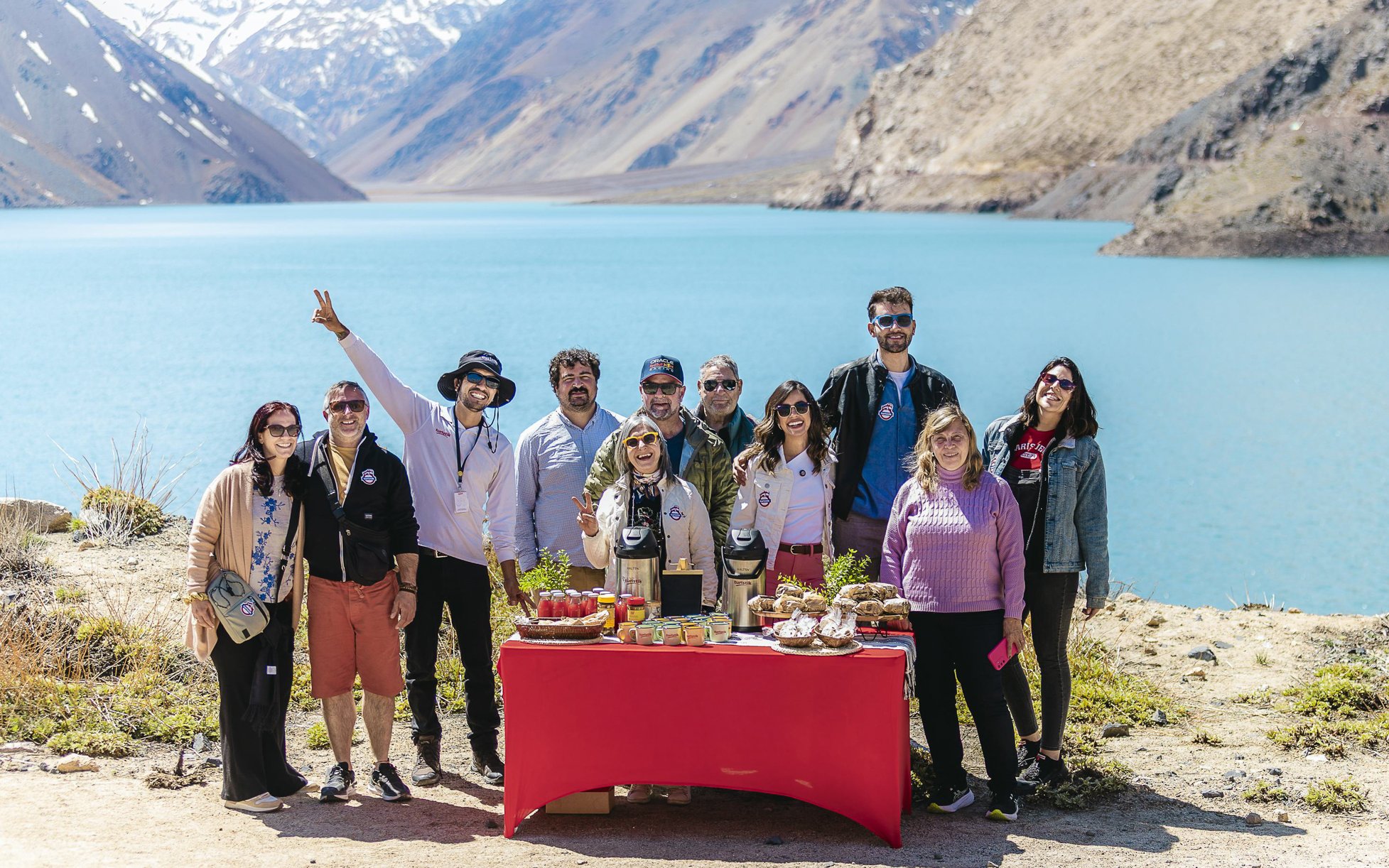 Group enjoying a picnic by the Embalse El Yeso in Chile.