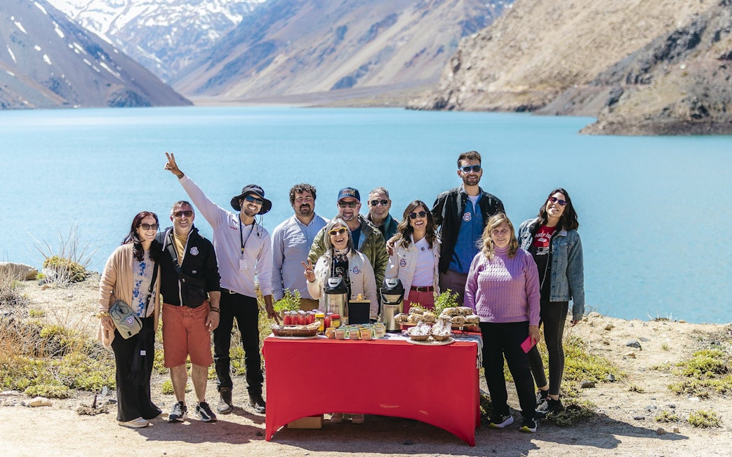 Group enjoying a picnic by the Embalse El Yeso in Chile.