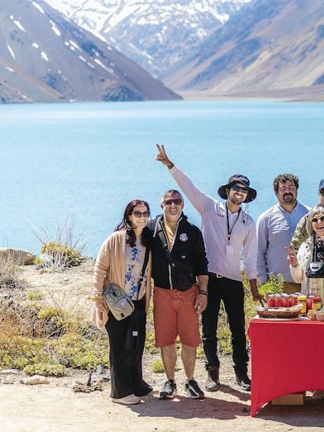 Group enjoying a picnic by the Embalse El Yeso in Chile.
