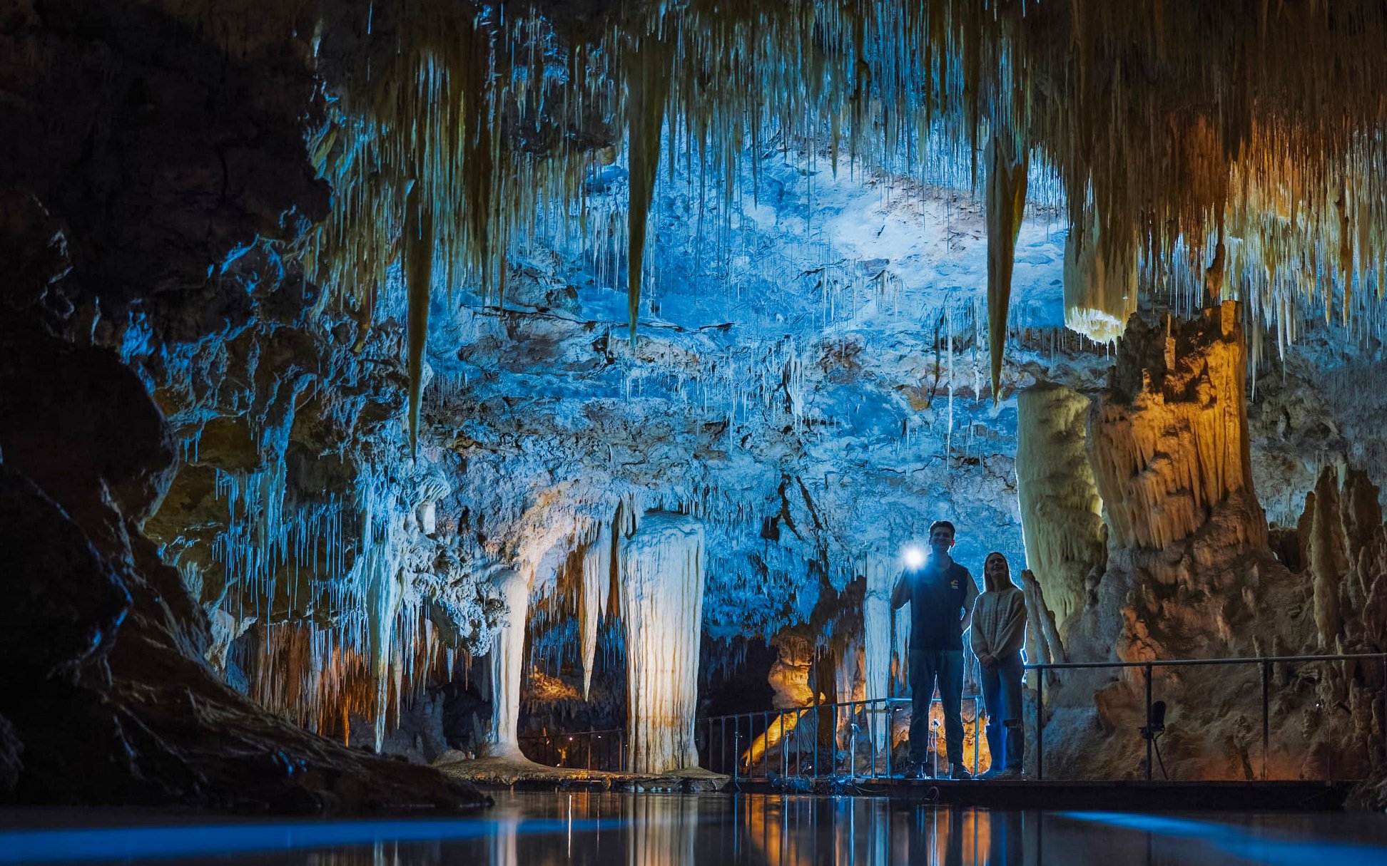 Exploring stalactites and stalagmites in Margaret River Caves, Australia.