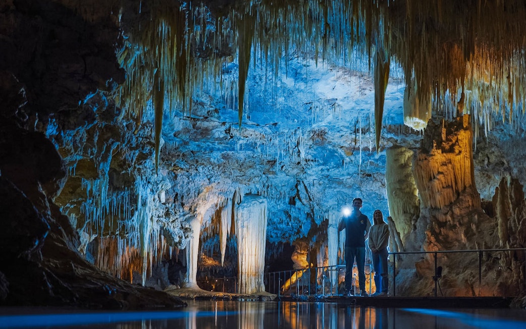 Exploring stalactites and stalagmites in Margaret River Caves, Australia.