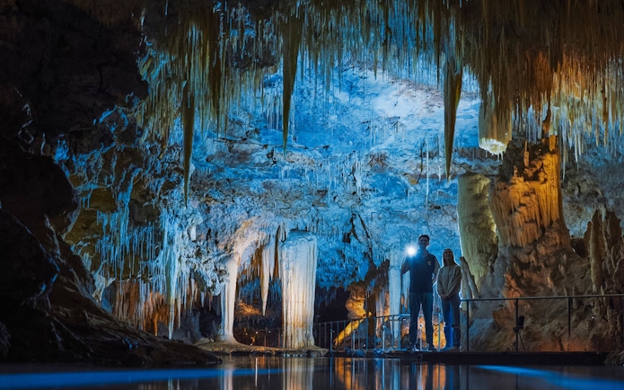 Exploring stalactites and stalagmites in Margaret River Caves, Australia.