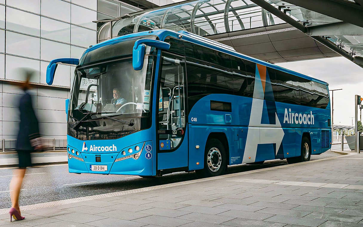 Dublin Aircoach bus at airport terminal for Dublin Airport transfers.