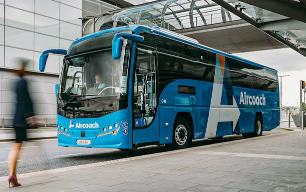 Dublin Aircoach bus at airport terminal for Dublin Airport transfers.
