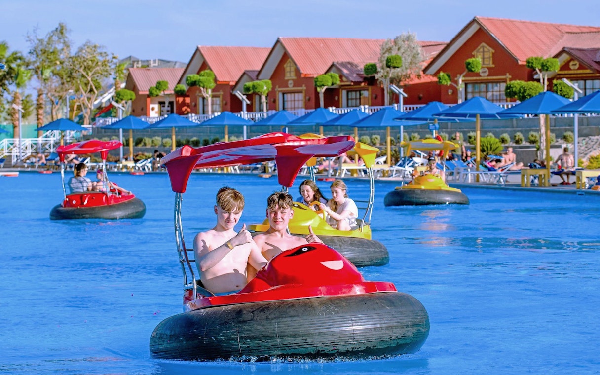 Kids enjoying bump boat ride at Neverland Waterpark, Pickalbatros, Hurghada.