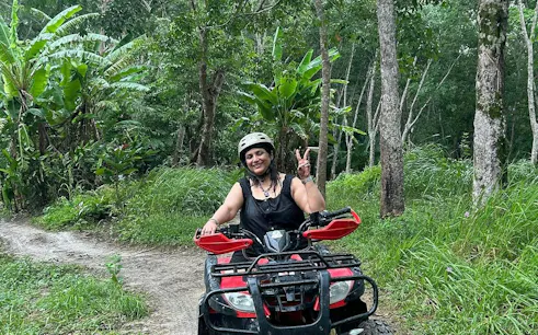 ATV rider on jungle trail near Patong Beach, Phuket.