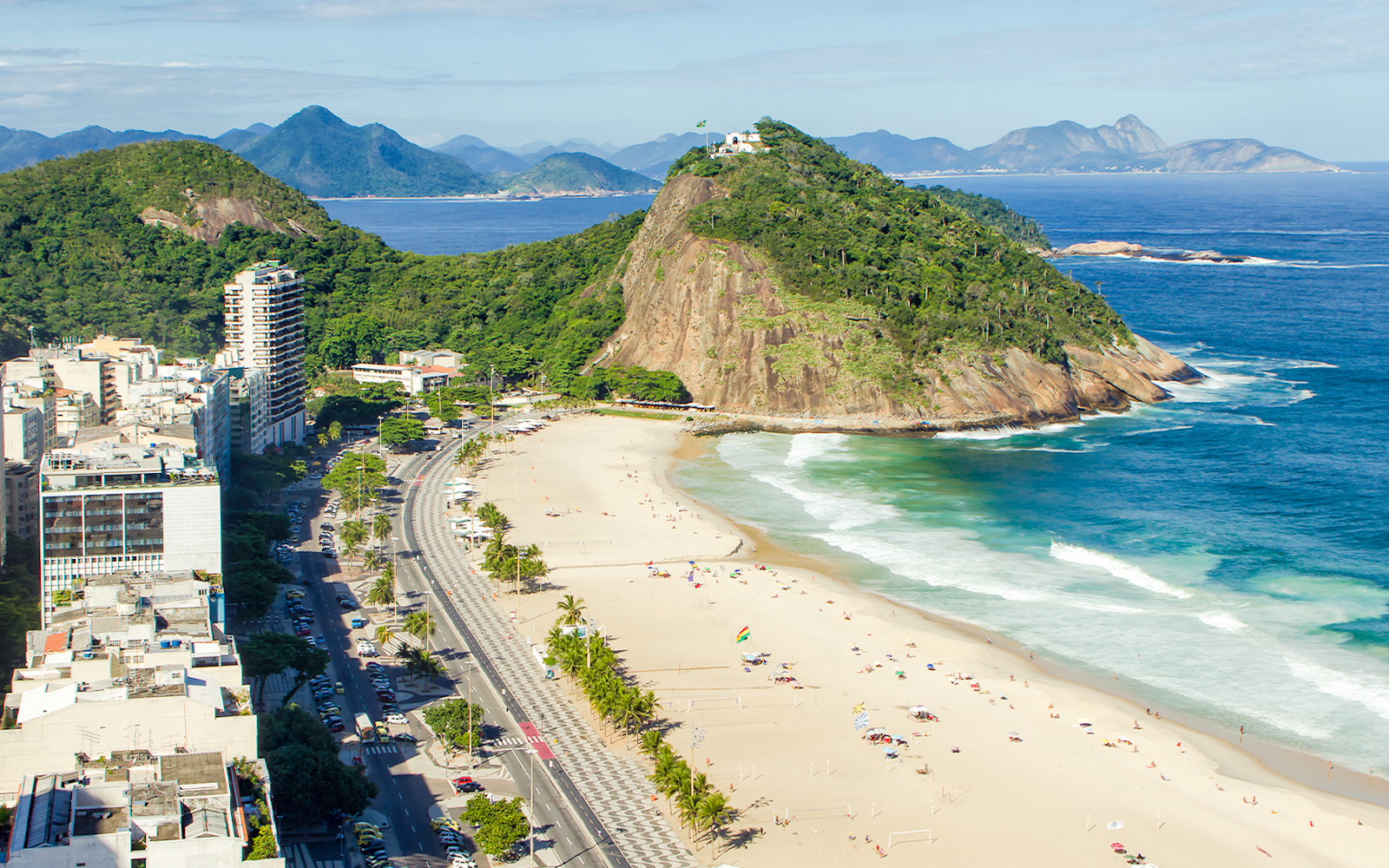 Copacabana Beach in Leme District, Rio de Janeiro, with Sugarloaf Mountain in the background.