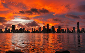 Cartagena skyline at sunset during a party cruise on the water.