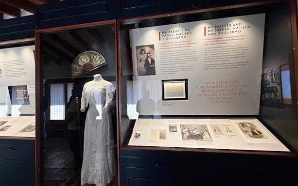 Exhibit at Frida Kahlo Museum featuring family history and a traditional dress.
