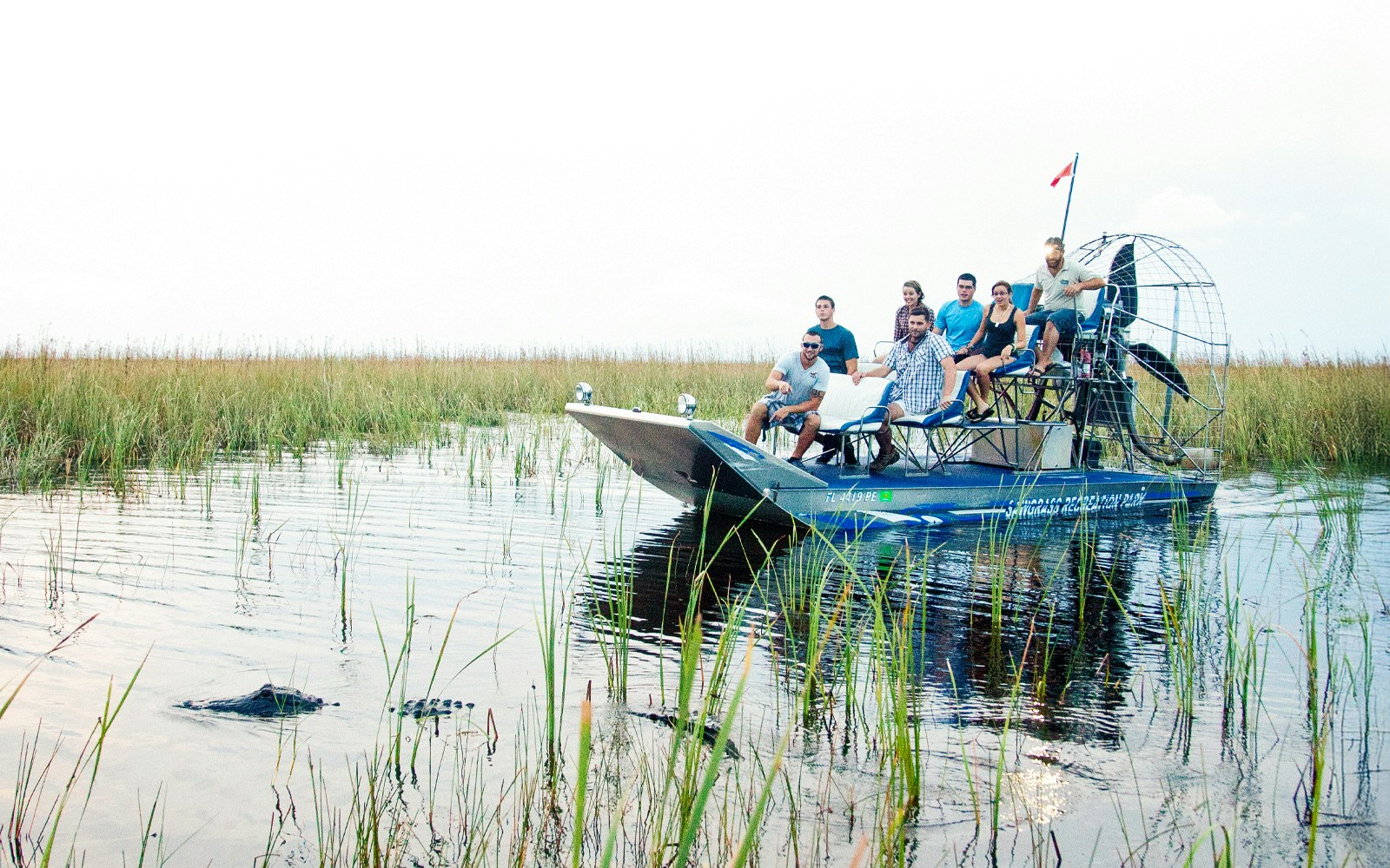 A wide shot of a Sawgrass Recreation Park airboat