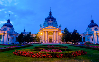 Szechenyi Thermal Bath illuminated at dusk, Budapest, Hungary.