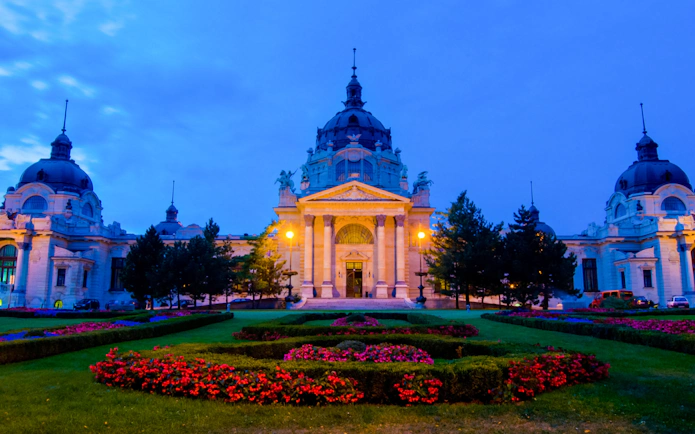 Szechenyi Thermal Bath illuminated at dusk, Budapest, Hungary.