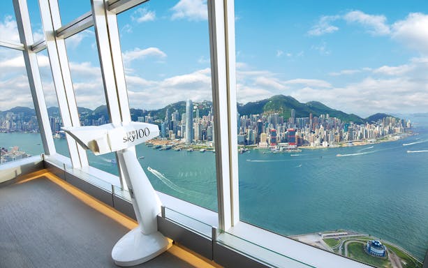 Sky100 observation deck view of Hong Kong skyline and Victoria Harbour.
