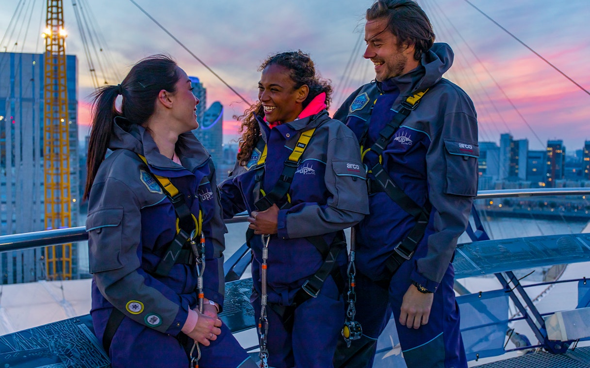 Guests enjoying a climb at the O2 in London during twilight.