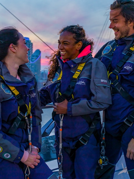 Guests enjoying a climb at the O2 in London during twilight.