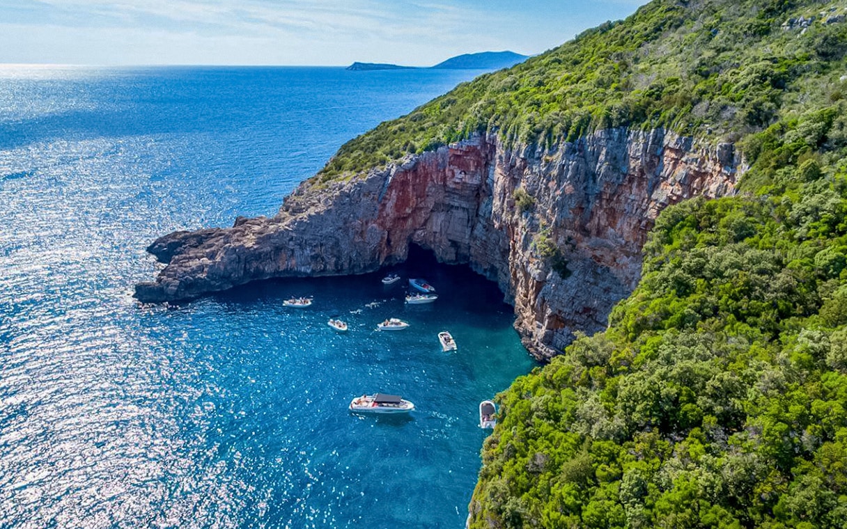 Aerial view of boats near cliffs in Kotor Bay, Montenegro.