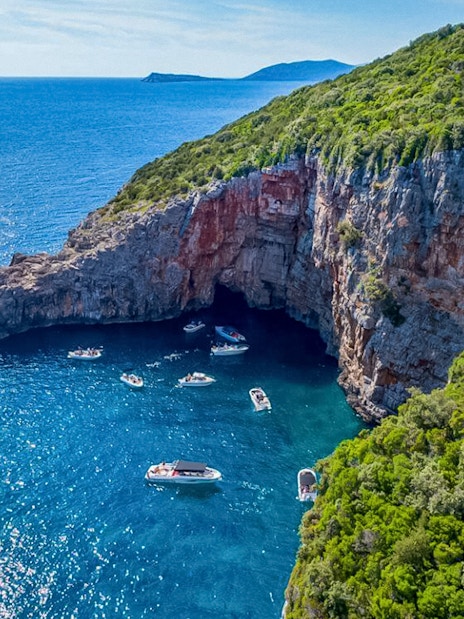 Aerial view of boats near cliffs in Kotor Bay, Montenegro.