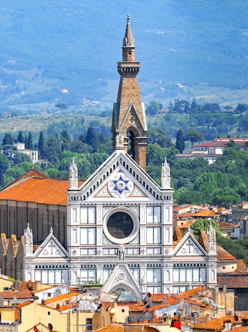Basilica of Santa Croce facade with bell tower in Florence, Italy.