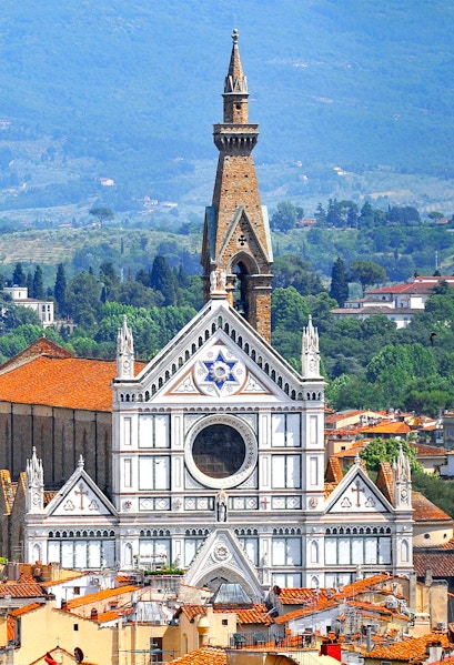Basilica of Santa Croce facade with bell tower in Florence, Italy.
