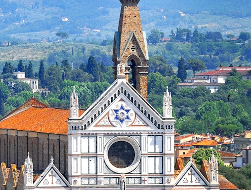 Basilica of Santa Croce facade with bell tower in Florence, Italy.