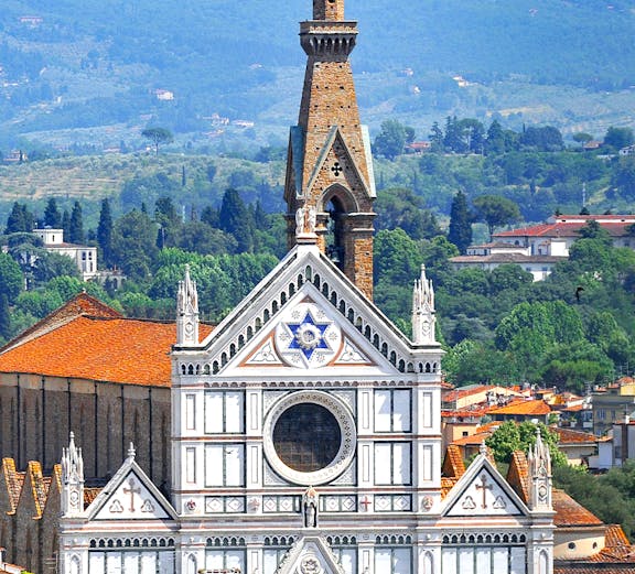 Basilica of Santa Croce facade with bell tower in Florence, Italy.