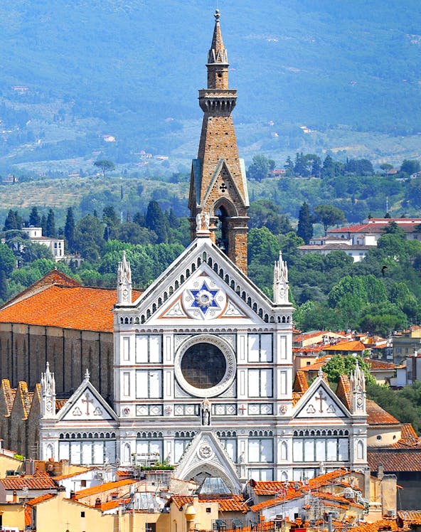 Basilica of Santa Croce facade with bell tower in Florence, Italy.